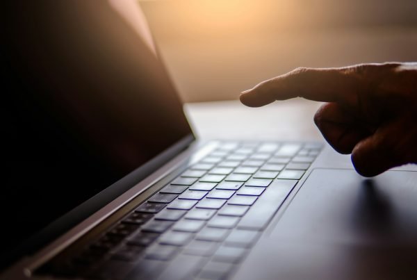 Point the finger on laptop with dark tone light, Security hacker concept